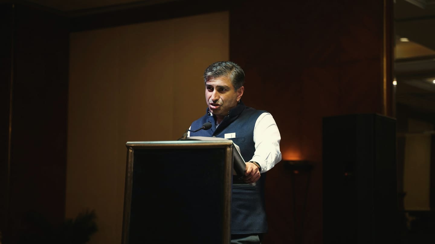 A speaker at a podium